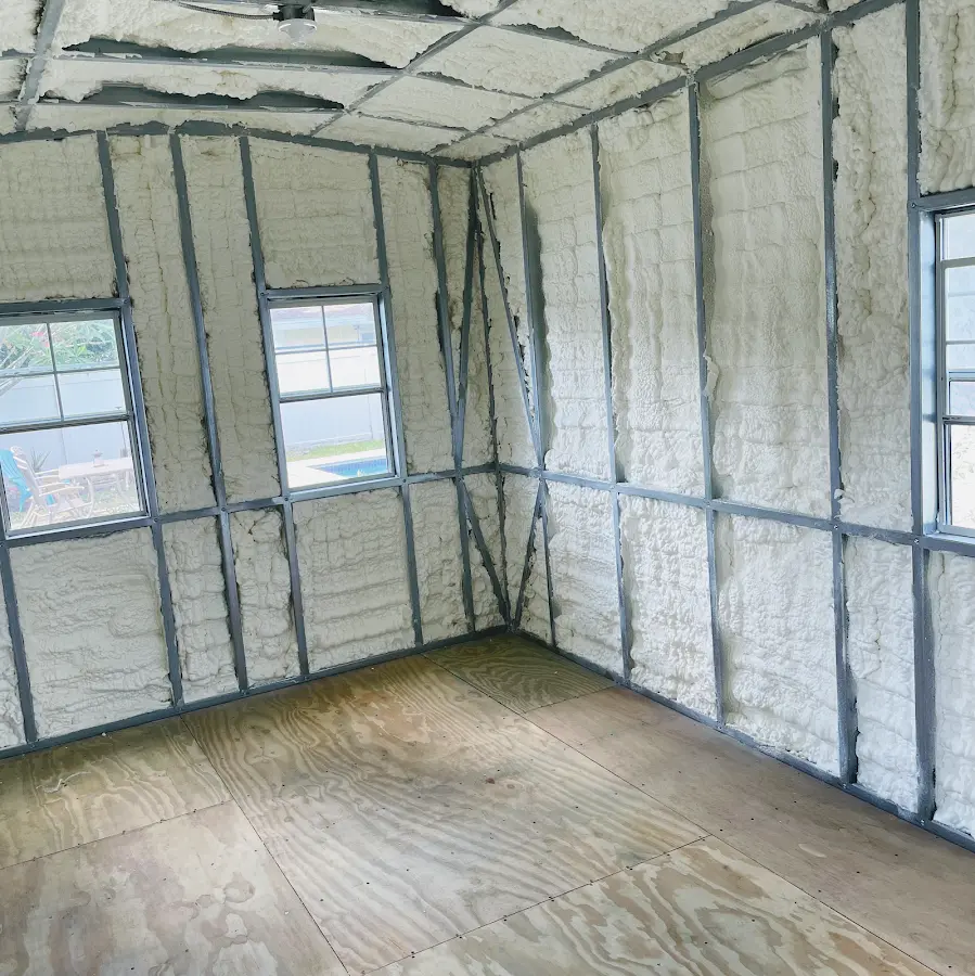 Closed-cell spray foam insulation applied to wall cavities in a residential project in Selma